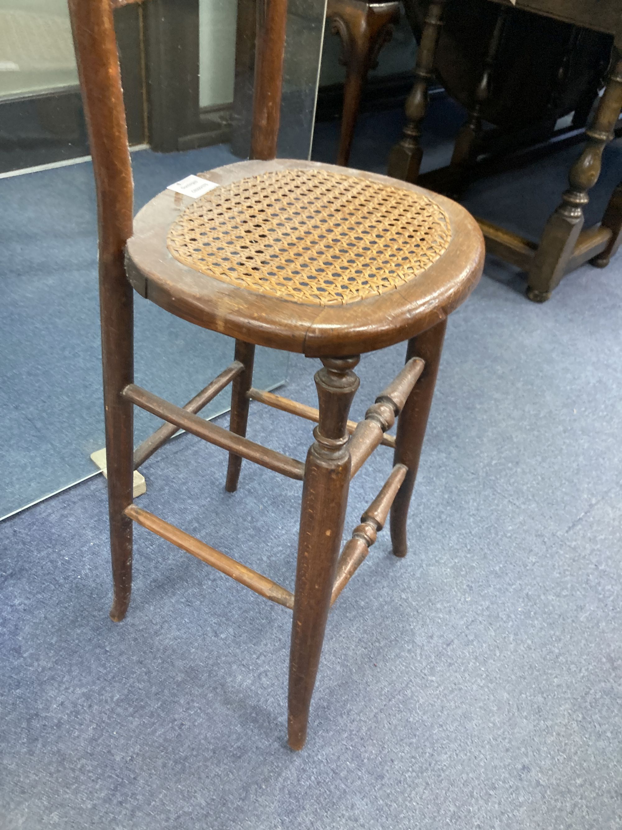 A Victorian beech cane seat correction chair